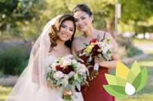 Nurse manager of Perianesthesia Anna Lee Sigueza poses with her cousin on her wedding day